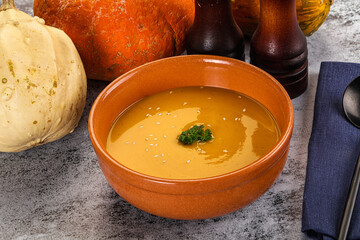 Vegan pumpkin cream soup served sesam