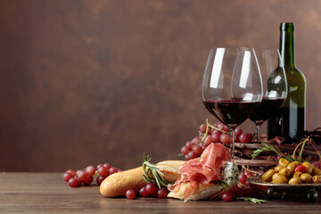  Delicious snack and glasses of red wine.