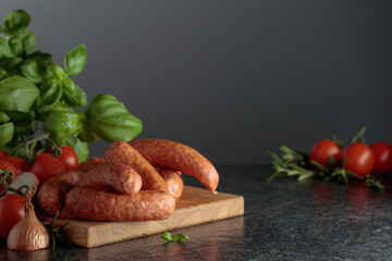 Sausages with basil, onion, rosemary, and tomatoes.