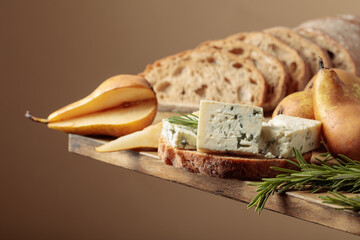 Sandwich with blue cheese, pears, and rosemary.