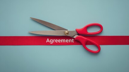 Scissors on red ribbon labeled agreement, symbolizing contract termination, cancellation, rescission, business conflict, failed negotiation, and broken deal.