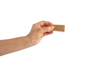Wafer biscuit with chocolate cream and hand isolated on transparent background