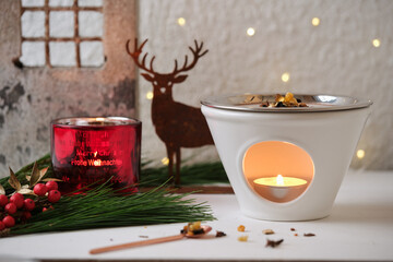 Incense burner with herbs and resins, festive ritual at Christmas