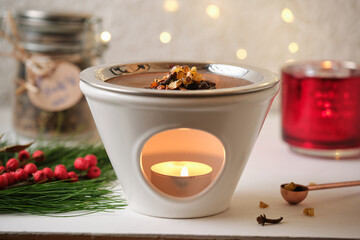 Close-up of Christmas incense ritual with herbs and resins