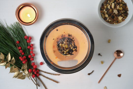 Overhead view of a Christmas incense ritual with herbs and resins