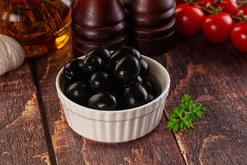 Mediterranean marinated Black olives in the bowl