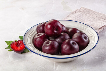 Raw ripe purple plum heap