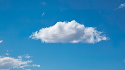 Single White Cloud in Blue Sky: Solitary Fluffy Cloud Against Clear Blue Sky, Serene Sky Scene with One White Cloud&mdash;Tranquil Nature View of Lone Cloud in Blue Sky