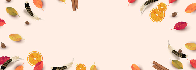 Autumn thanksgiving background with colorful leaves orange slices feathers acorns and cinnamon sticks with empty copy space for seasonal design and festive use