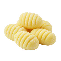 Yellow gnocchi pasta pieces stacked on a white background  