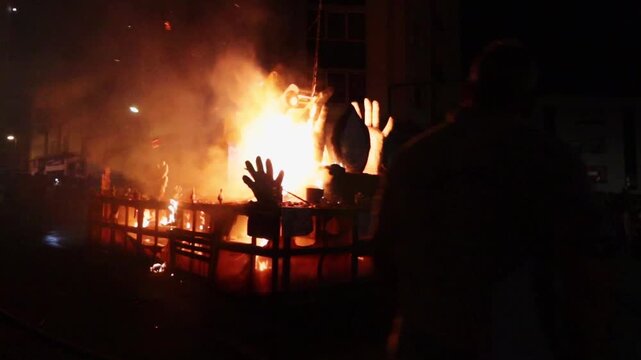 San Juan fire during celebration with people and fireman