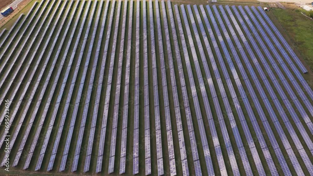 Poster an array of solar panels in the sun creates energy and converts it into electricity. a modern ecolog