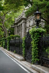 Obraz premium Estate Building Behind Wrought Iron Fence