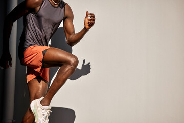 Athletic man exercising outdoors on a sunny day in vibrant sportswear
