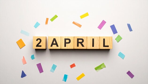 Wooden Blocks with Date 2 April. Calendar for birthday or anniversary on solid colored background with confetti