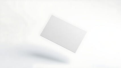 An elegant business card floating in mid-air against a clean, minimalist white background.