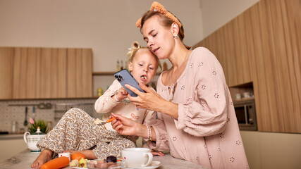 Mother and daughter spending time together in a cozy kitchen environment