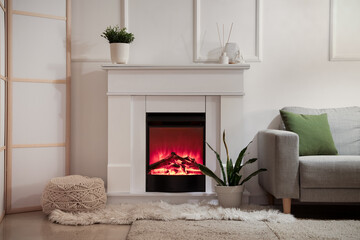 Cozy interior of dark living room with fireplace and sofa, closeup