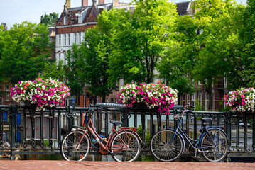 Bicycles, popular mode of transport, parked on the streets of Amsterdam, capital of Netherlands