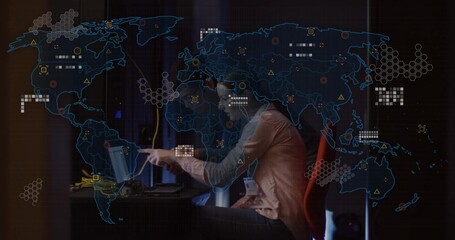 Pointing woman in blazer guiding colleague analyzing on laptop with map overlay in control room