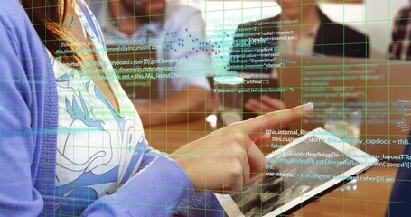 Tapping tablet developer wearing purple cardigan at workshop, with desks and floating code overlay