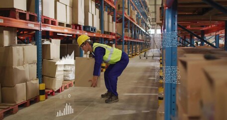 Bending knees Korean warehouse worker lifting cardboard box in aisle with helmet, vest, AR overlays
