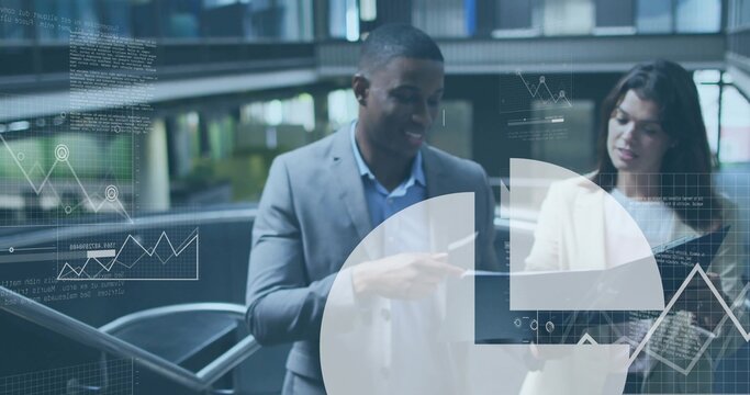 Pointing midcareer colleagues revealing trends on laptop at mezzanine atrium, with chart overlays