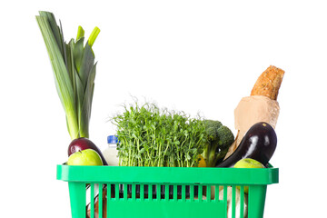 Green shopping basket with different fresh products on white background