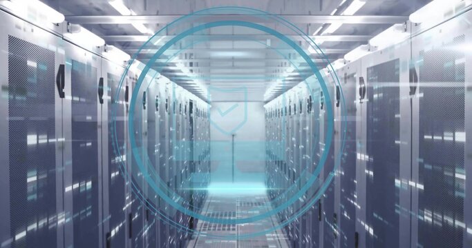 Projecting holographic security shield icon above raised floor in corridor with lit racks and LEDs