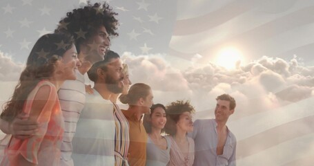 Standing eight friends wearing summer wear under clouds and sun rays, with translucent USA flag