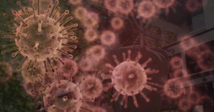 Standing man wearing protective suit and medical face mask in glass entrance, with virus graphics - Powered by Adobe