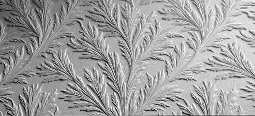 Delicate, embossed foliage pattern on a light gray surface
