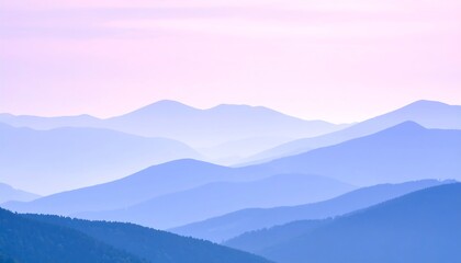Obraz premium Pale blue mountain ranges fade into the soft pastel sky at dawn or dusk.
