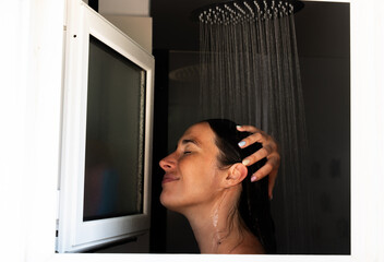 Happy woman enjoying a relaxing shower