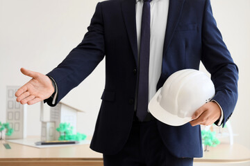 Male architect with hardhat in office