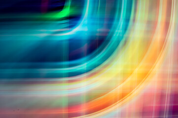 A digital abstract art piece featuring vibrant, overlapping yellow and orange light trails forming fluid, curving lines against a dark, blurred background.