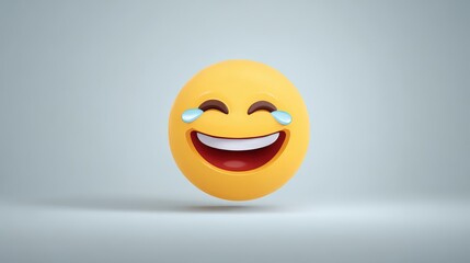 Fototapeta premium Close-up of a bright yellow laughing emoji face with cheerful expression and tears of joy isolated on a plain light gray background