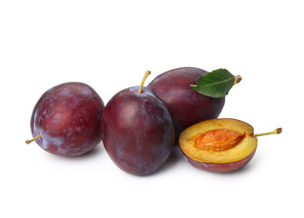 Fresh ripe plums on white background