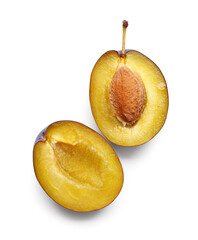 Halves of fresh ripe plum on white background