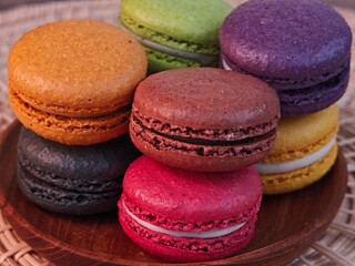 Sweet colorful of macarons on plate.