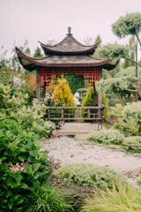 Charming Garden Shed with Lush Greenery and Blooming Flowers