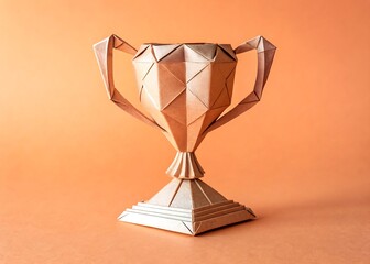 origami trophy angled flat on pastel orange background