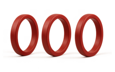 Three red rings arranged in a row on a neutral background simple product shot