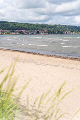The stunning beach view in Southern Sweden and charming coastal town under a beautiful cloudy sky, Bastad, Sweden