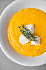 Creamy butternut squash soup with feta and thyme