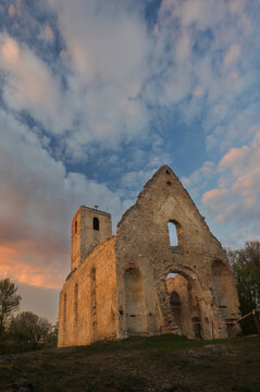 View of the weathered stone ruins of Katar&Atilde;&shy;nka monastery stand tall against a sky painted with the warm hues of sunset, Dechtice, Trnavsk&Atilde;&frac12; kraj, Slovakia.