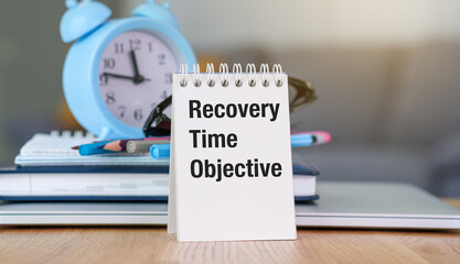 There is notebook with the word Recovery Time Objective. It is as an eye-catching image.
