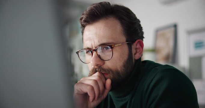 Research, planning or man in home with computer, mortgage or application. Serious, thinking or person in finance with tech, saving or budget in investment with choice, knowledge or reading for loan