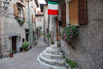 Old houses in an alley in Pieve di Tremosine, Lake Garda, Italy