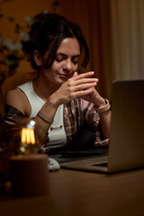 tired graphic designer woman working at home office remotely using digital graphic tablet and laptop